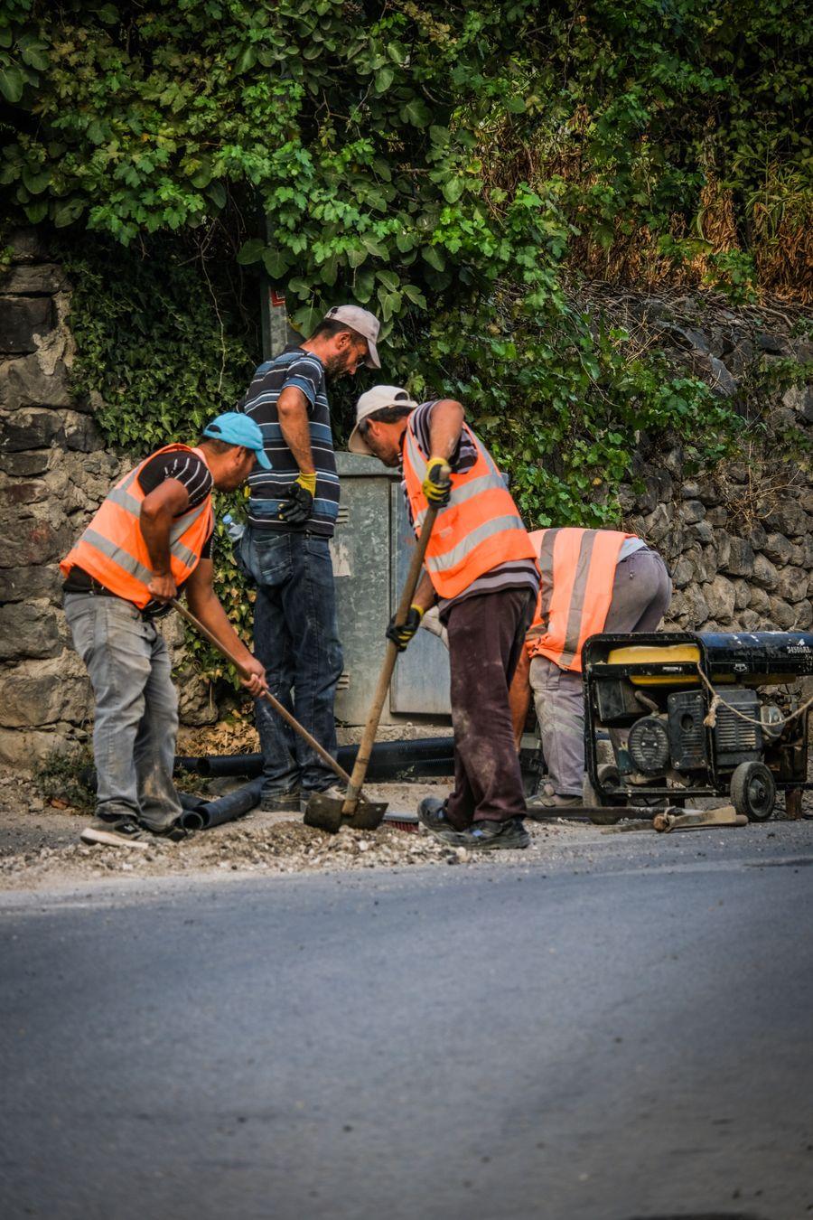 A crew working on a pavement repair